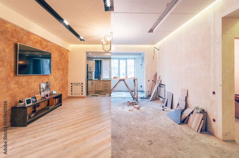 Modern open-plan room under renovation, with wood flooring, exposed walls, and construction materials scattered around