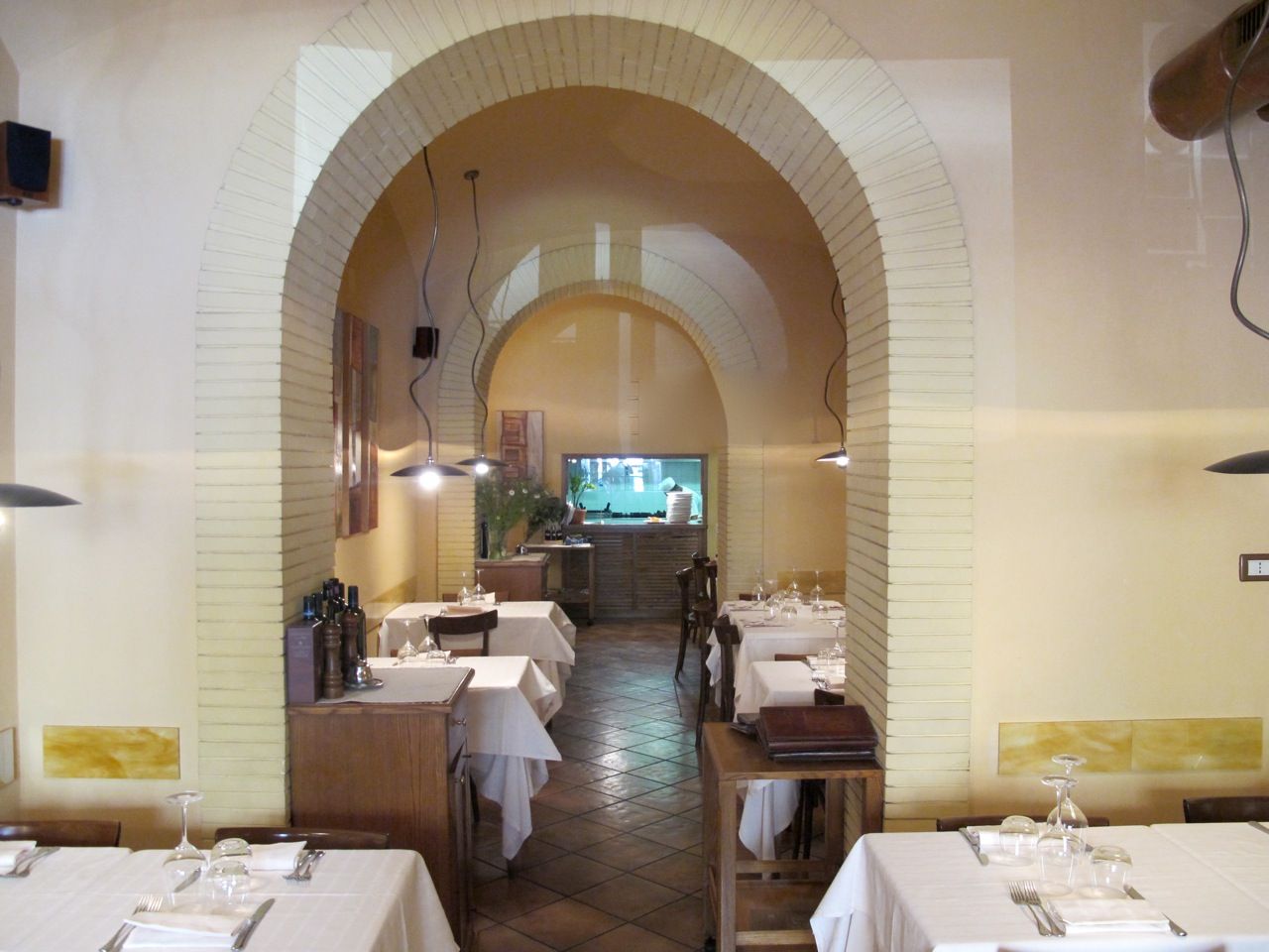 The inside of a restaurant with tables and chairs