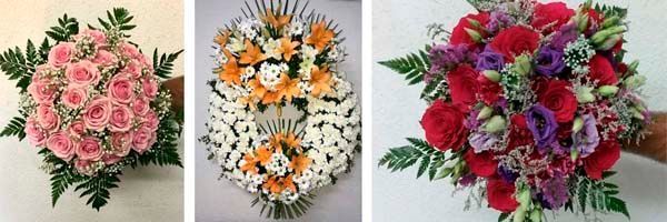 Una persona sostiene tres ramos de flores diferentes.