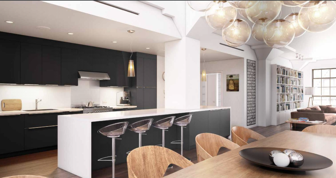 Cuisine noire avec plan snack et mobilier en bois clair