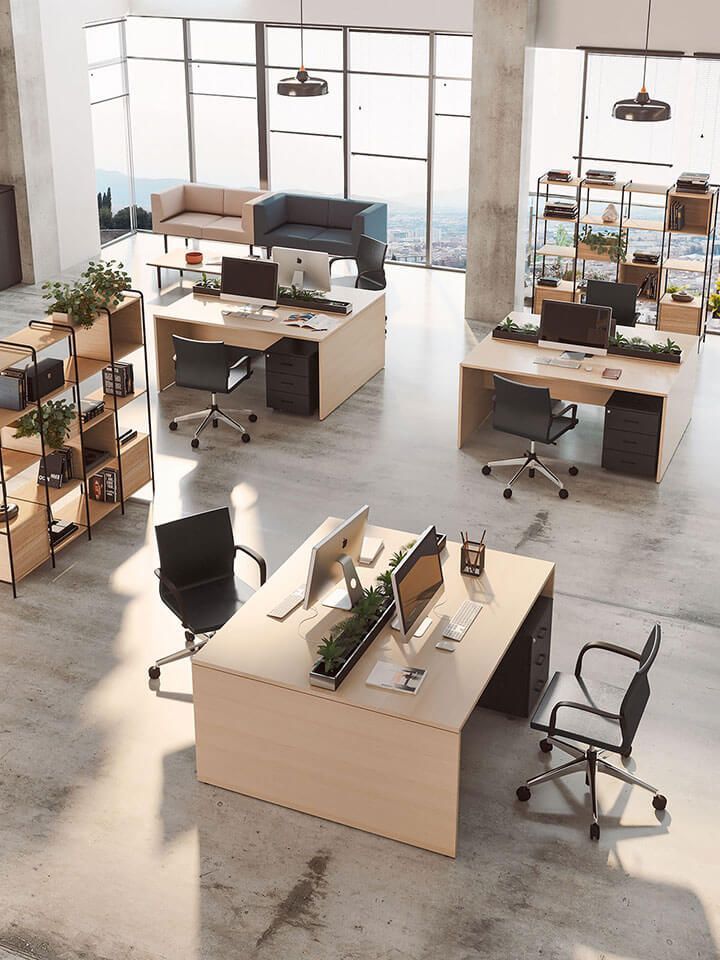 Vue plongeante sur un open space avec trois îlots de bureaux deux places en vis à vis