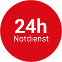 Ein roter Kreis mit der Aufschrift „24h Notdienst“ darauf.