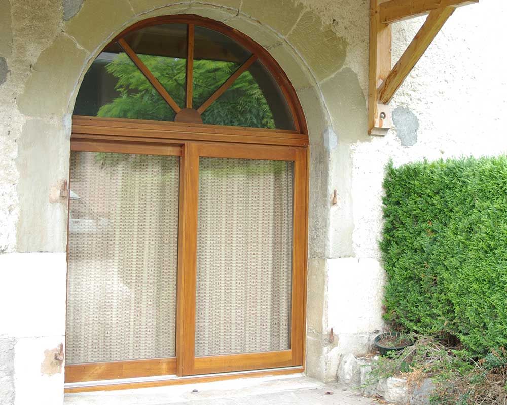 Baie coulissante cintrée