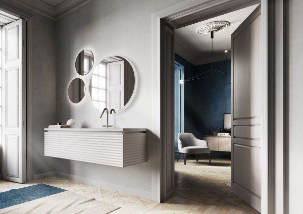 Salle de bains avec miroir ronds et vasque suspendue
