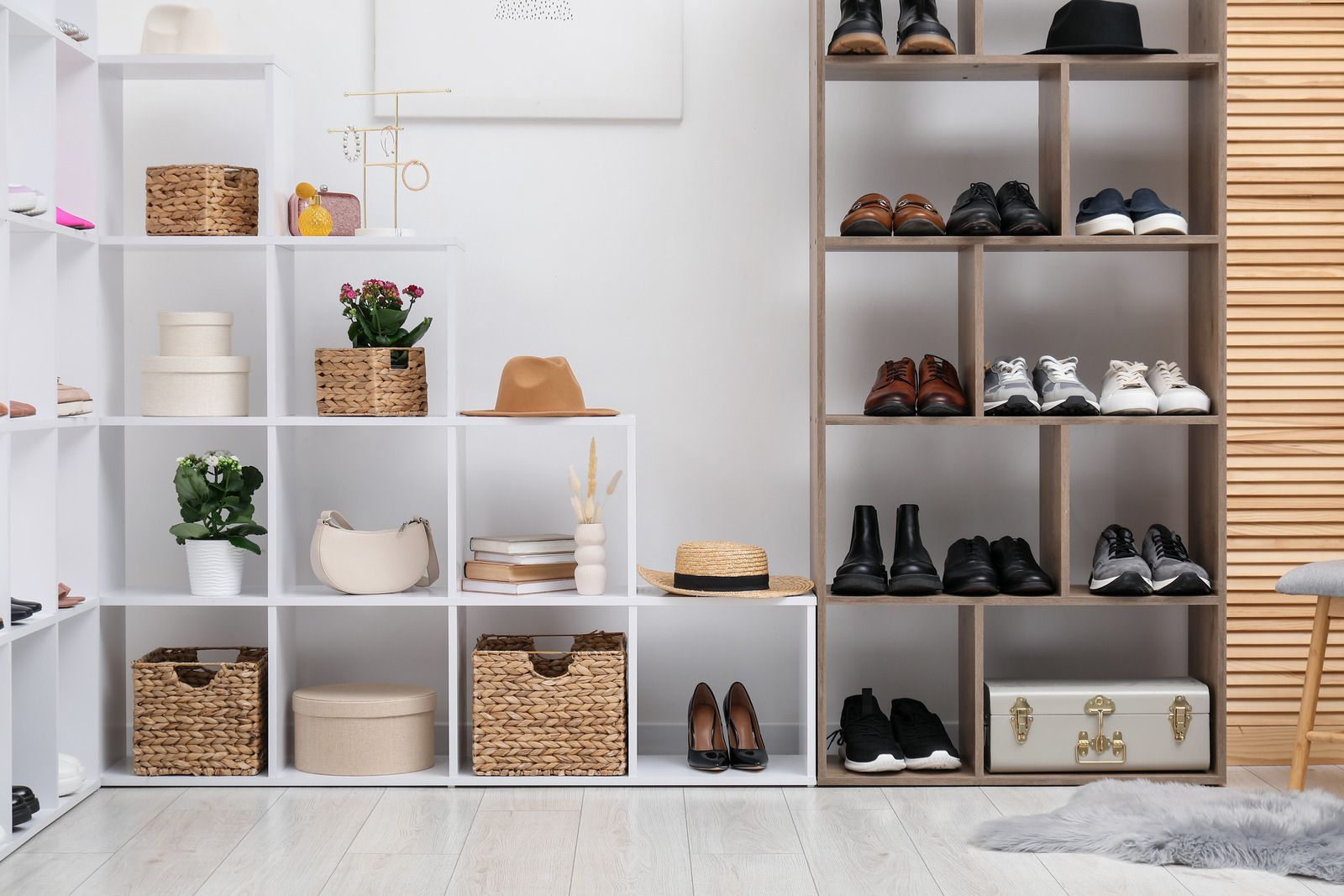 Shelved closet organized with shoes, baskets, and decor in a bright white room