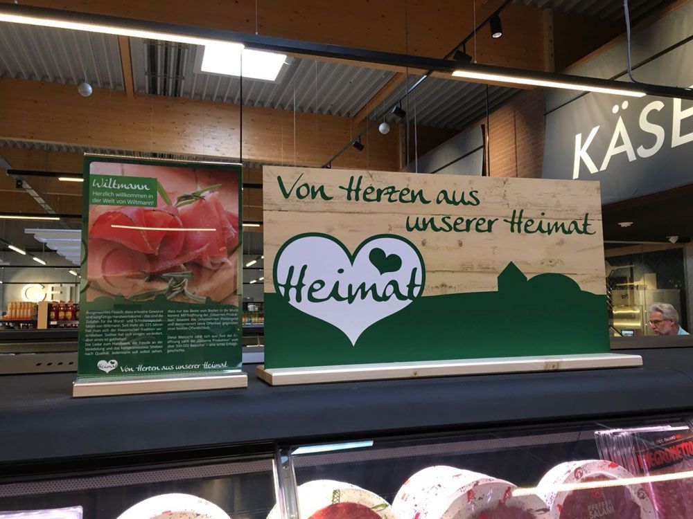 A sign in a store that says von herzen aus unserer heimat