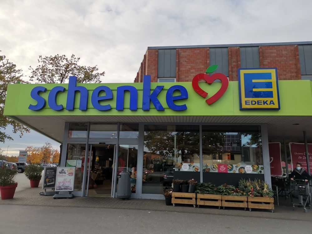 Schenke edeka store front with a green sign