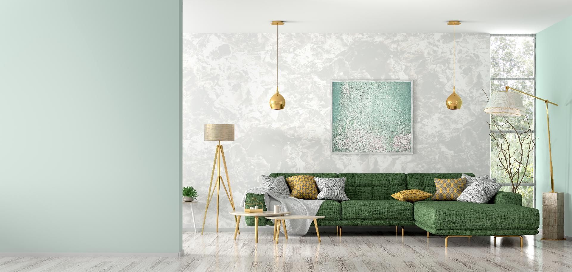 Elegantes, modernes Wohnzimmer mit grüner Eckcouch, goldenen Akzenten und mintgrüner Wandvertäfelung