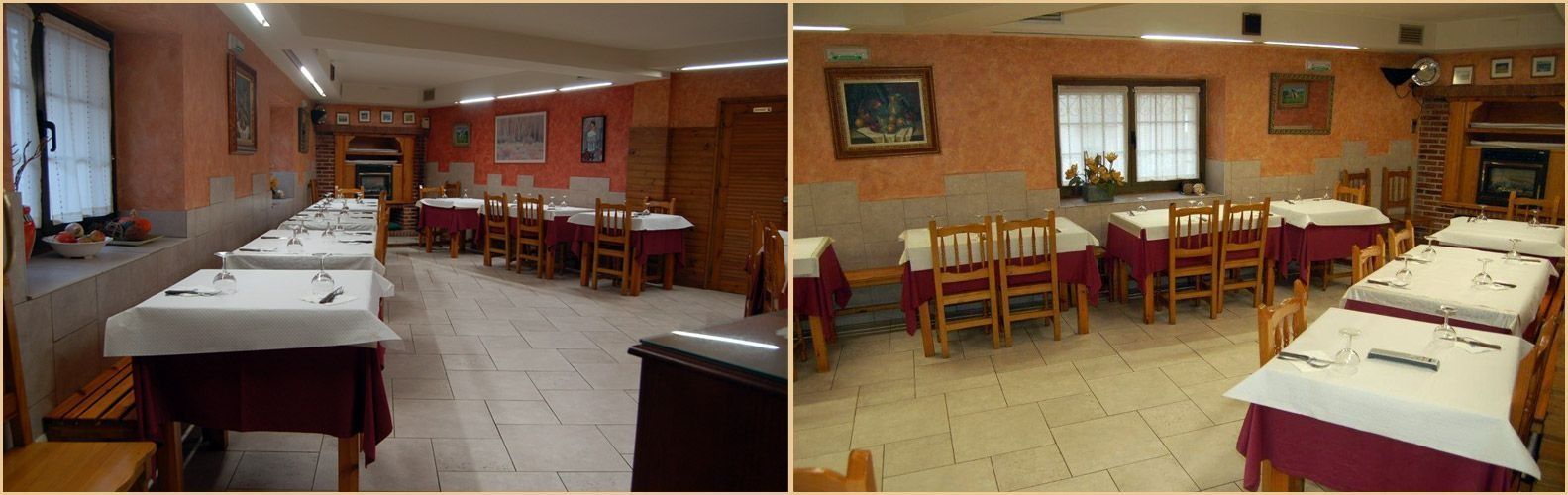 Pequeño comedor con filas de mesas y sillas de madera, mesas con manteles blancos y paredes naranjas bajo las ventanas.