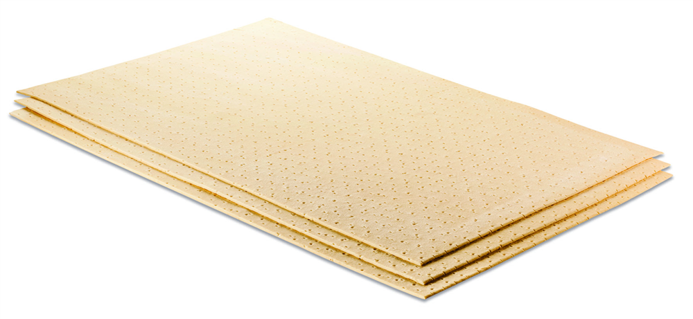 Trois coussinets absorbants beiges, empilés et légèrement inclinés.