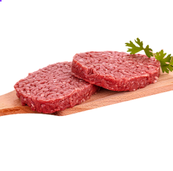 Deux steaks hachés de bœuf crus sur une planche à découper en bois, garnis de persil.