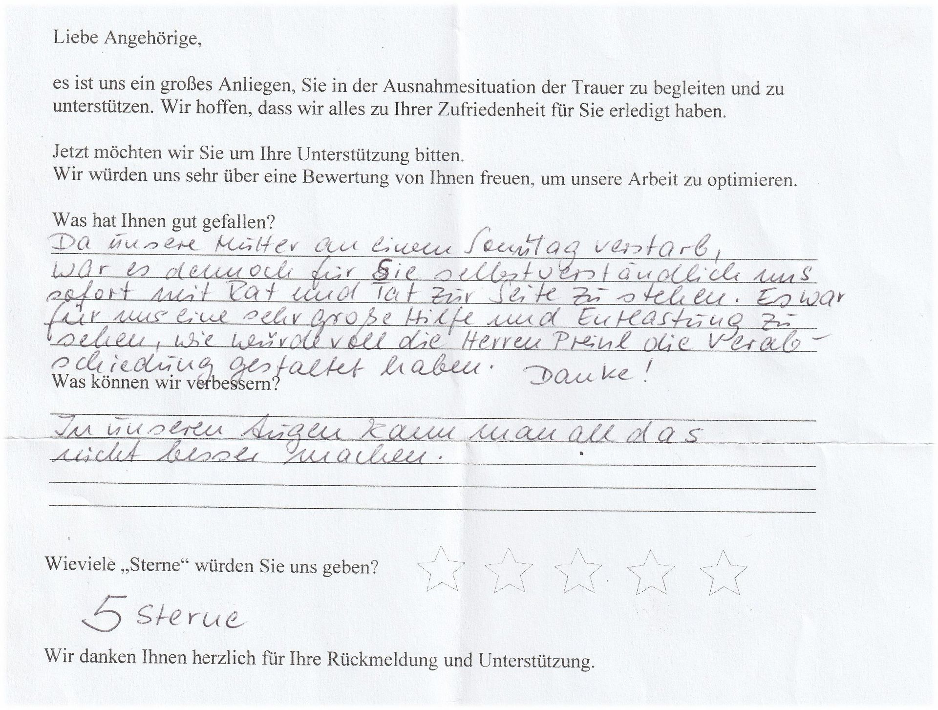 Ein handgeschriebener deutscher Brief mit einer Umfrage zum Service und einer 5-Sterne-Bewertung.