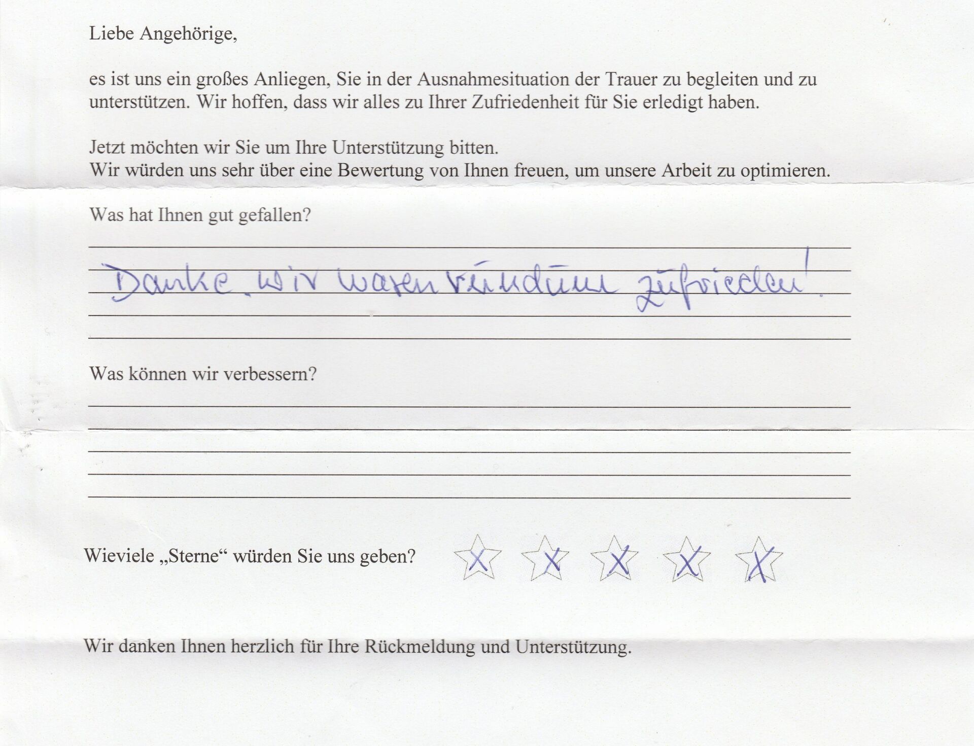 Handwritten customer feedback form; a person writes