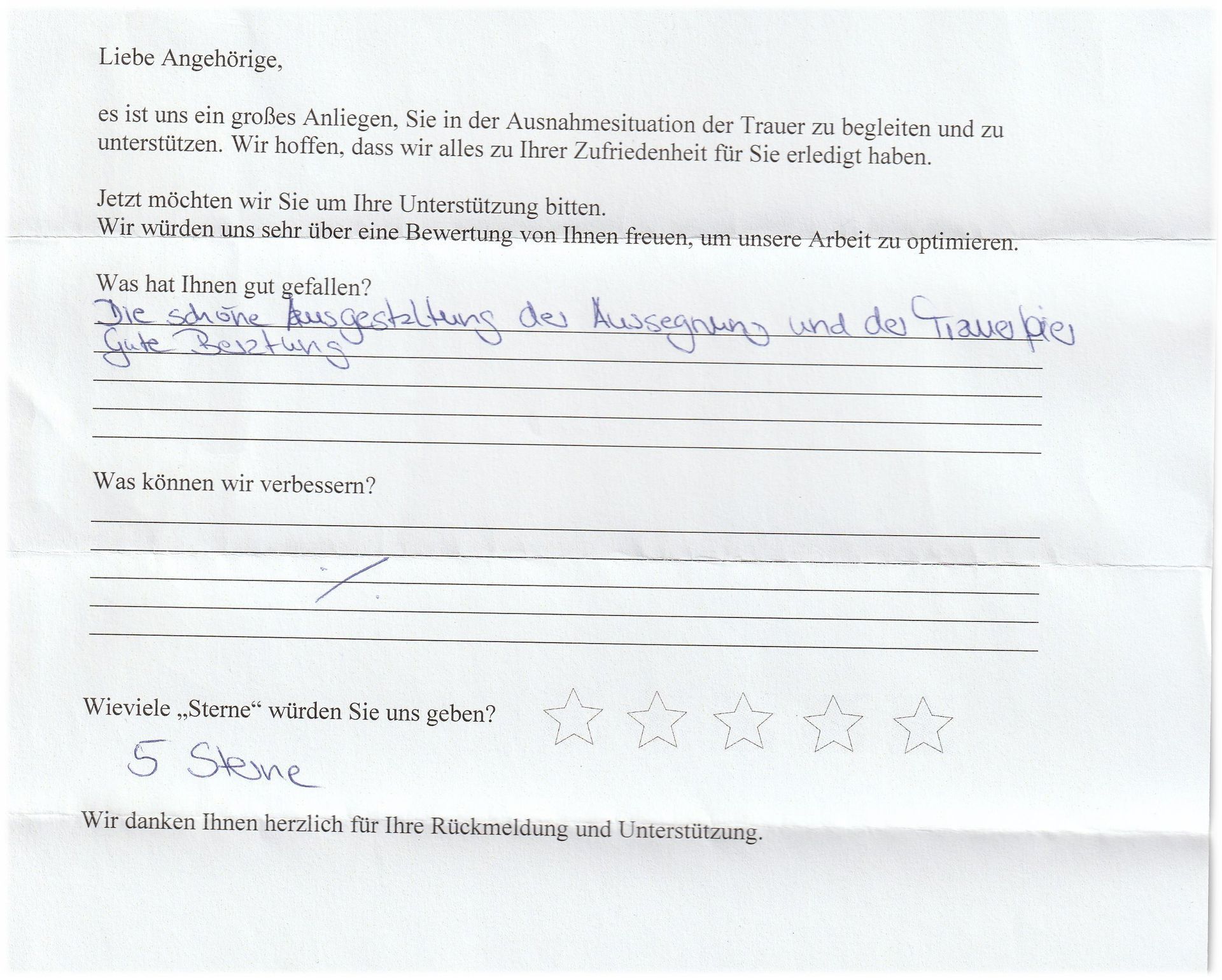 German feedback form with handwritten answers, including