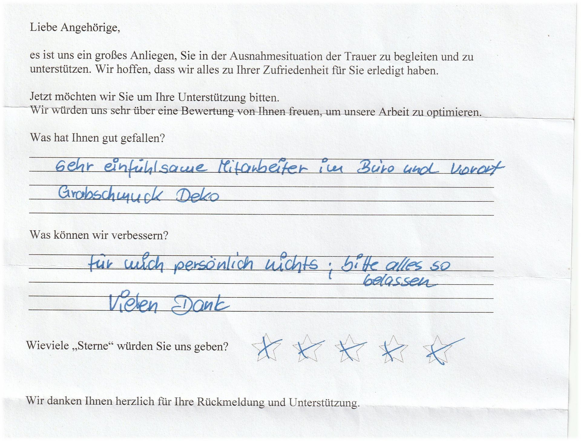 Handschriftlicher Feedbackbogen: „Sensibler Büro- und Blumenmitarbeiter“, Bewertung mit Sternen, „gar nichts, so lassen wie es ist.“