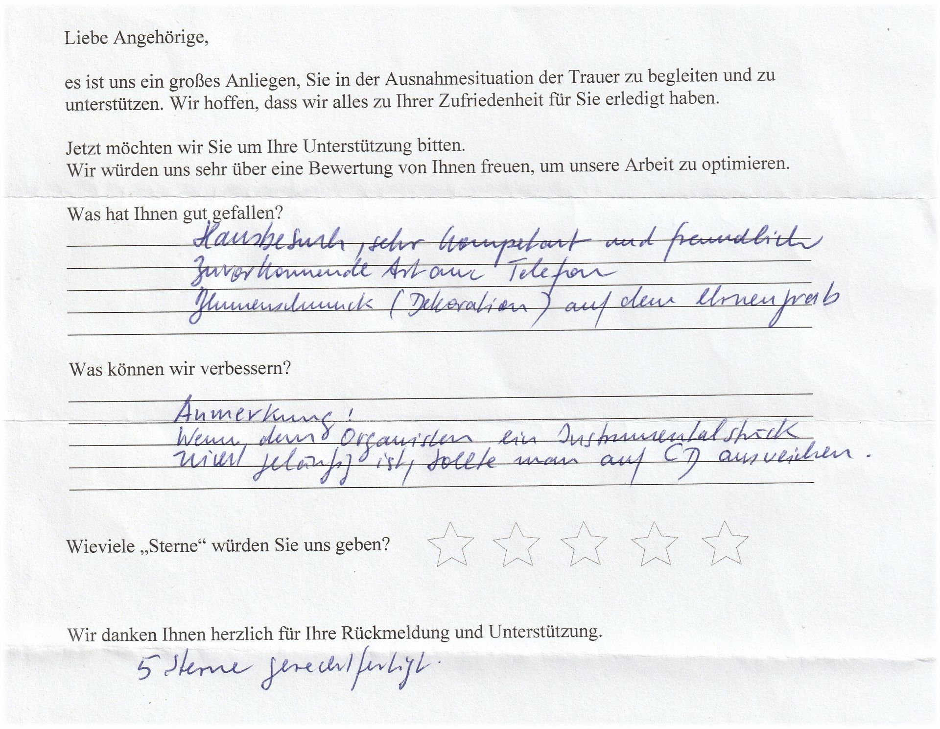 Handschriftliches Feedbackformular mit deutschem Text, inklusive Sternebewertung.