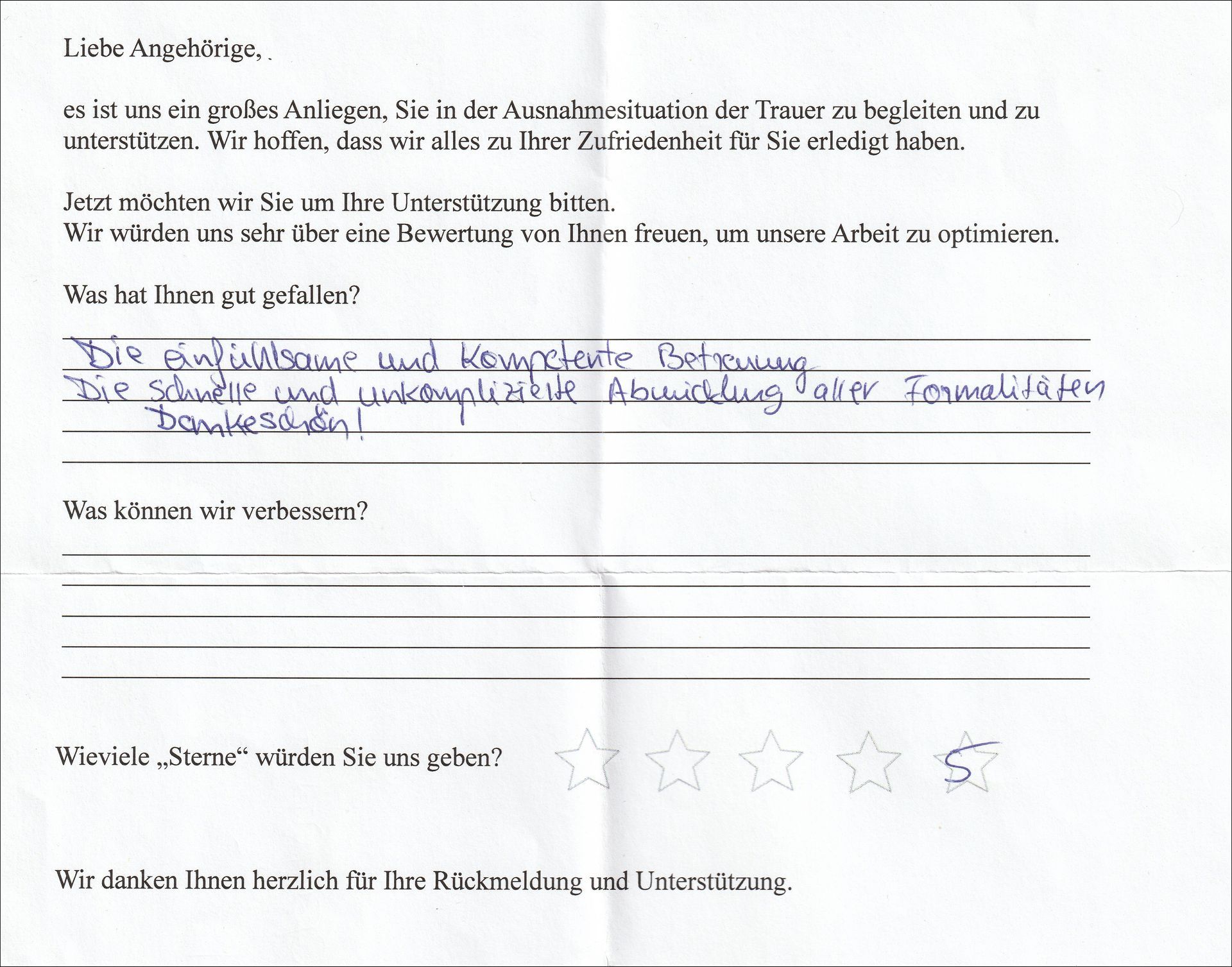 Handschriftliches Feedbackformular mit deutschem Text und Sternebewertung.