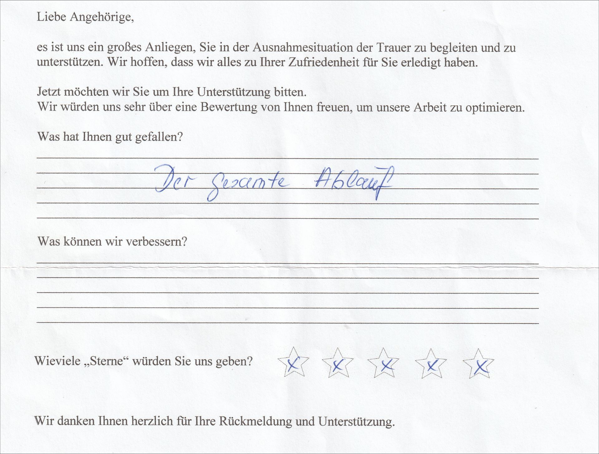A handwritten feedback form. A person writes,