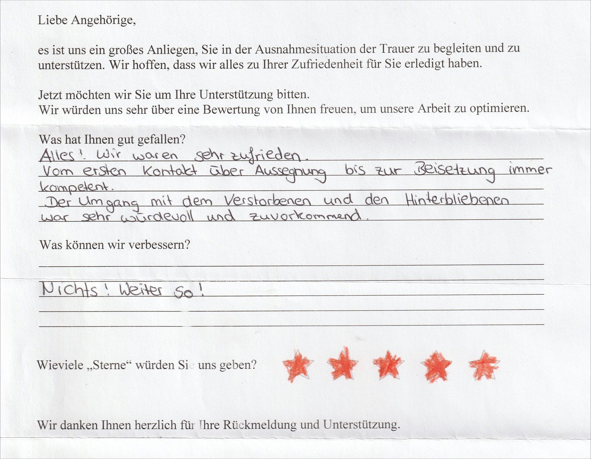 Handschriftliches Feedbackformular mit deutschem Text, ausgefüllten Antworten und einer 5-Sterne-Bewertung.