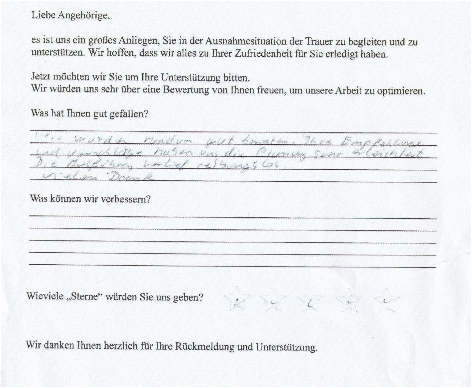 Handschriftliches Feedbackformular mit deutschem Text, in dem nach Feedback zur Veranstaltung zu Verbesserungsaspekten und positiven Kommentaren gefragt wird.
