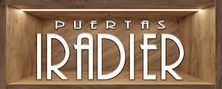 Logotipo de "Iradier Doors" en un nicho de madera, iluminado desde arriba.