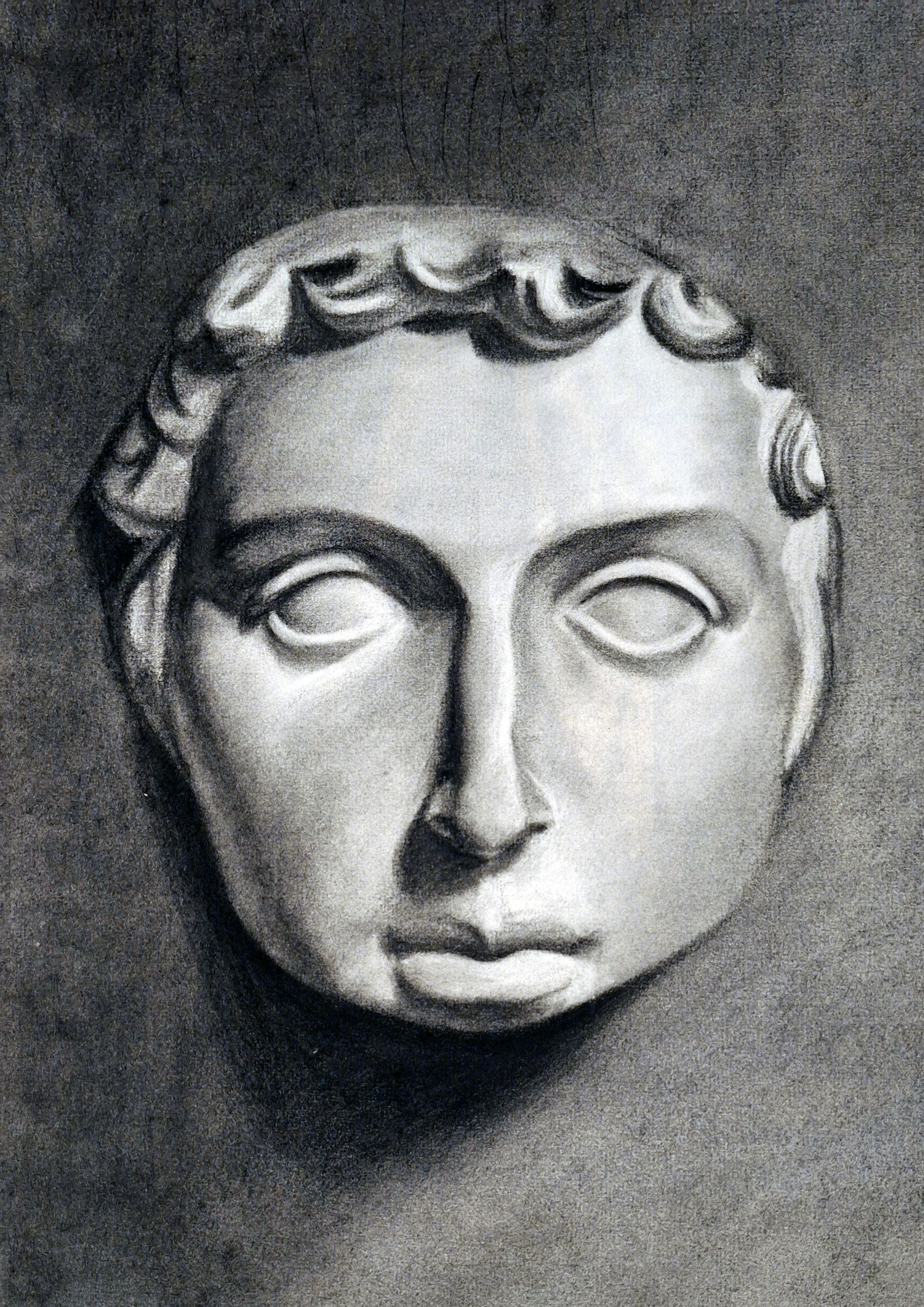 Un dibujo en blanco y negro de una estatua de la cara de un hombre.