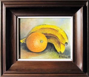 Un cuadro enmarcado de plátanos y una naranja de Elena.