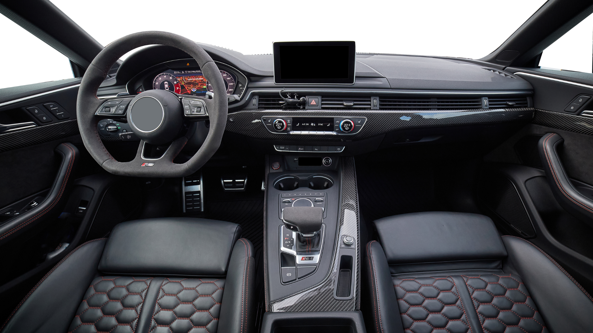 L'intérieur d'une voiture avec un volant et un tableau de bord.