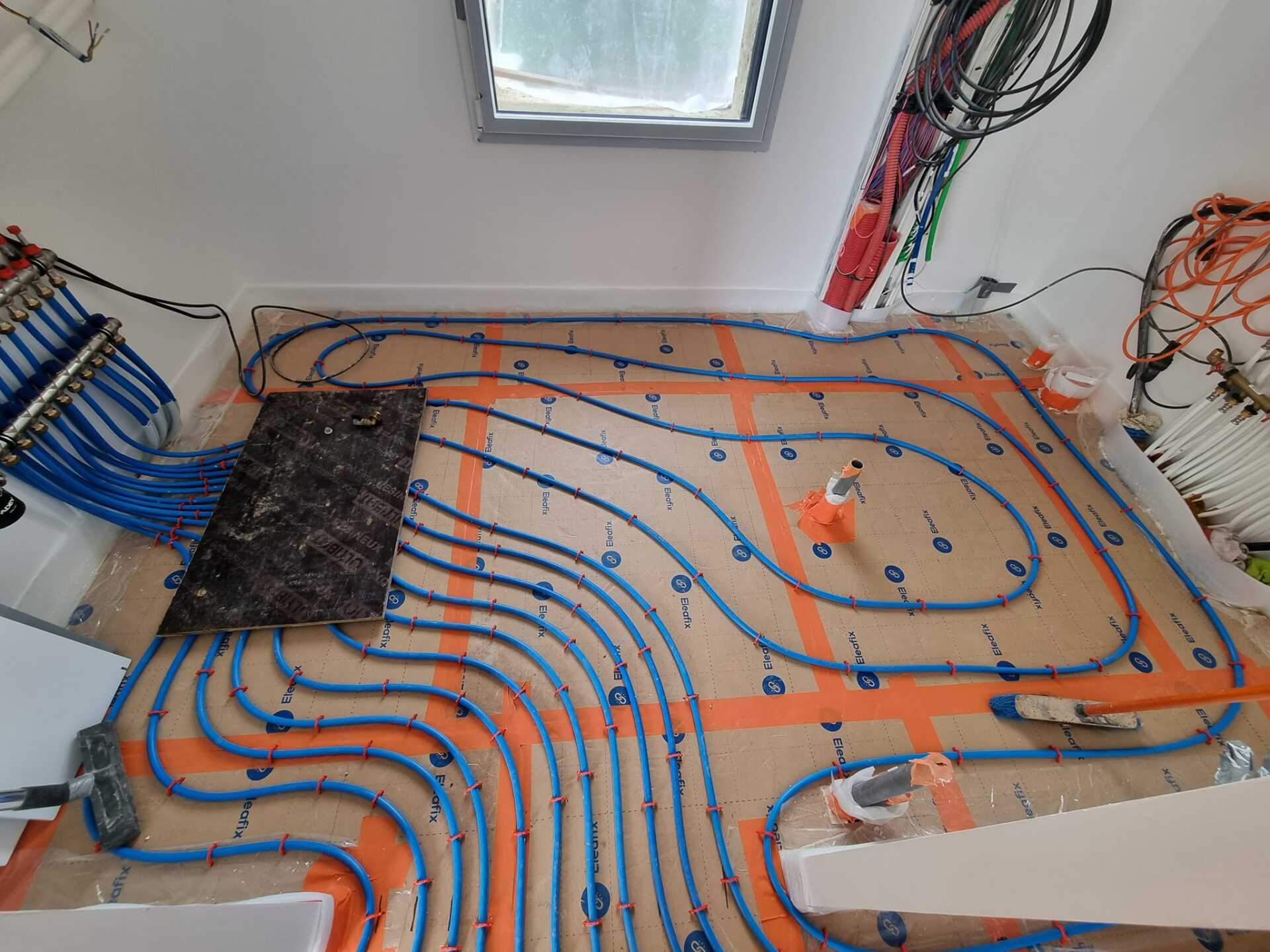 Installation du système de sol chauffant avant recouvrement