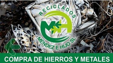 A sign that says compra de hierros y metales on it