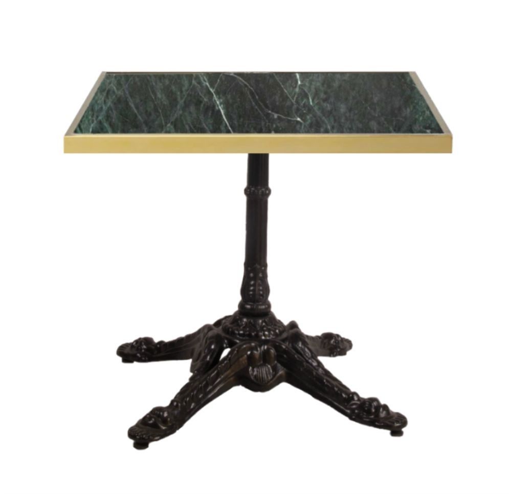 Una mesa pequeña con tapa de mármol verde y base negra.
