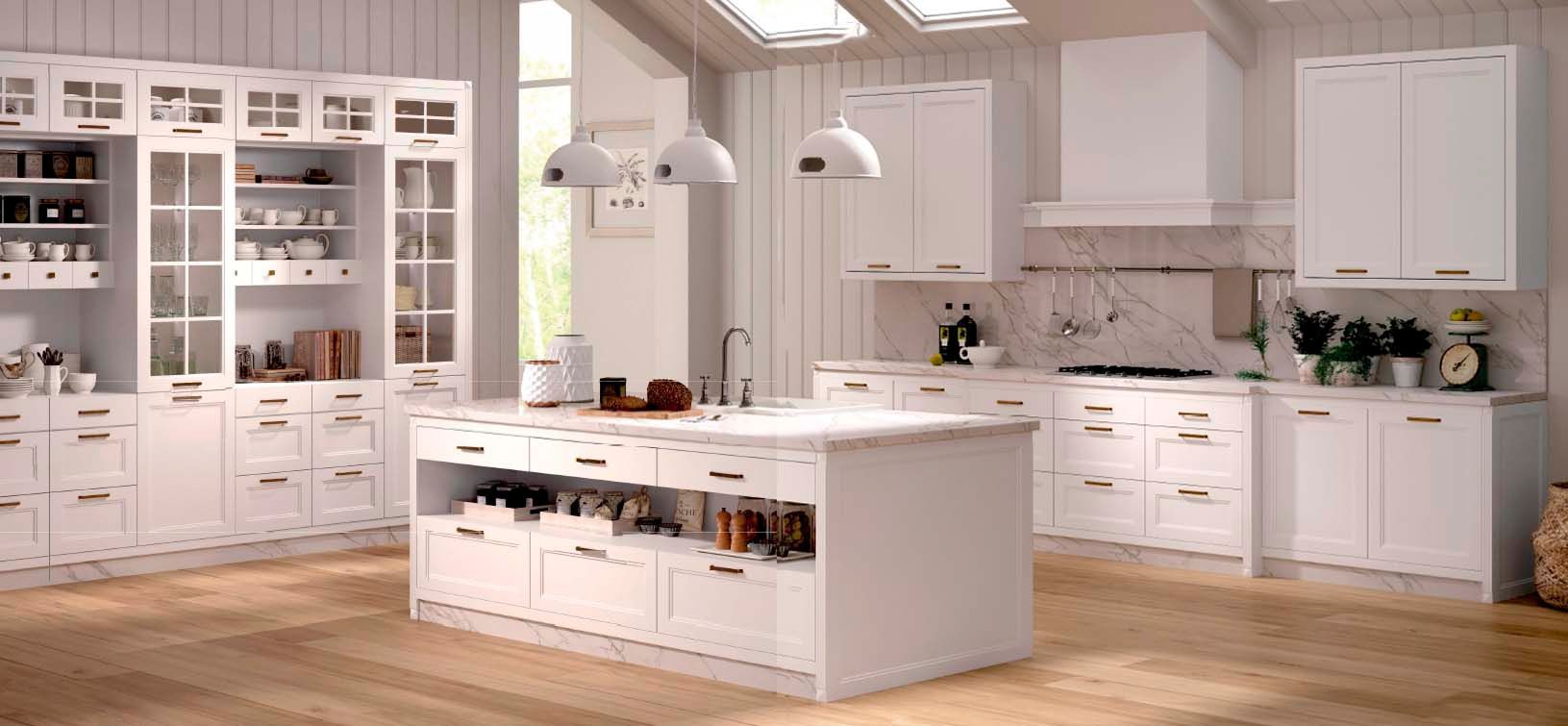 Una cocina con gabinetes blancos y una gran isla en el medio.