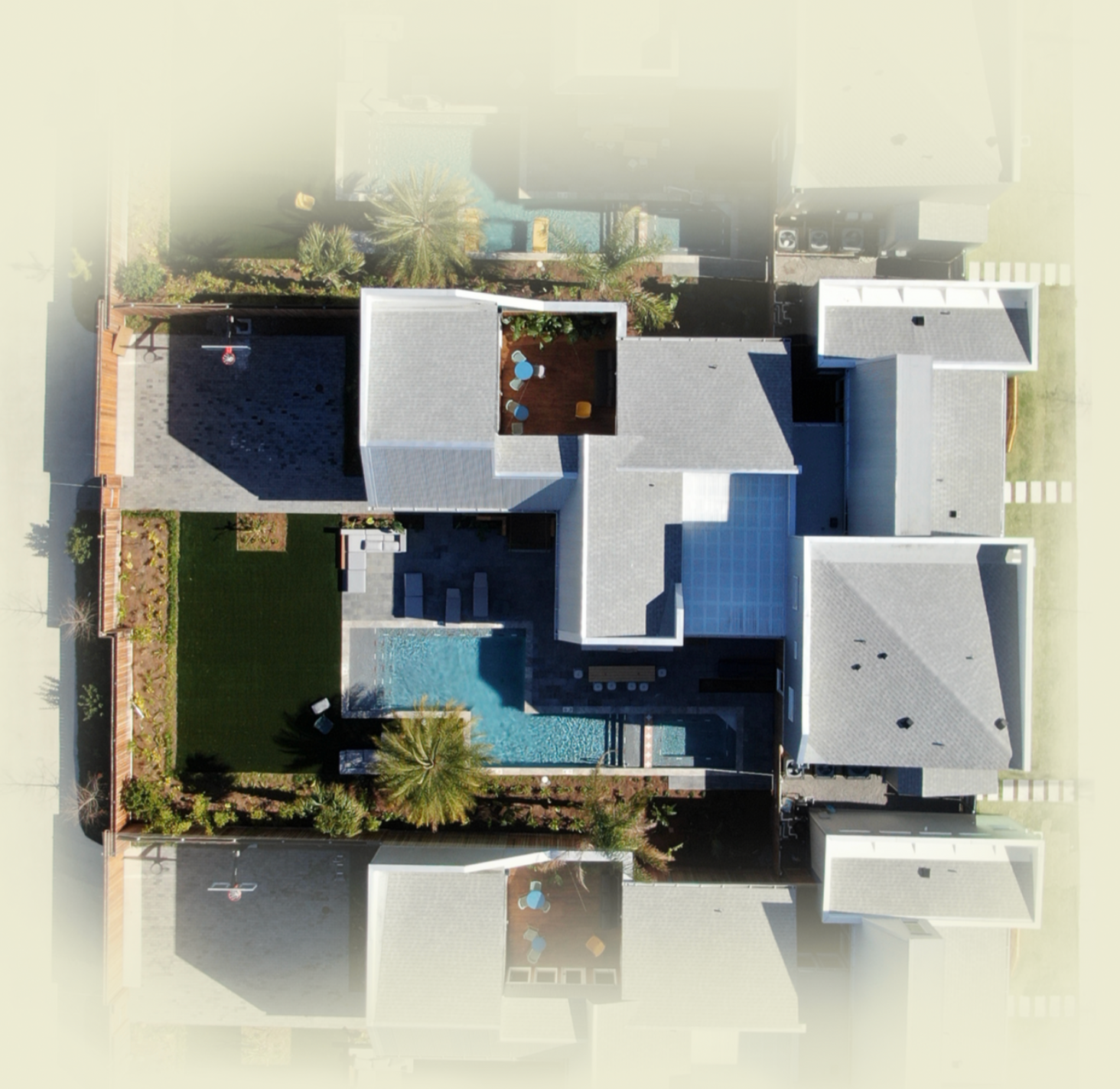 An aerial view of a house with a pool