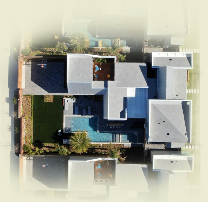 An aerial view of a house with a pool