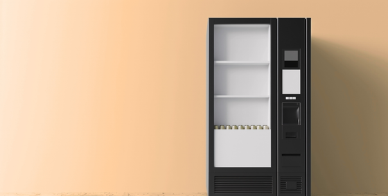 Un distributeur automatique vide noir et blanc.