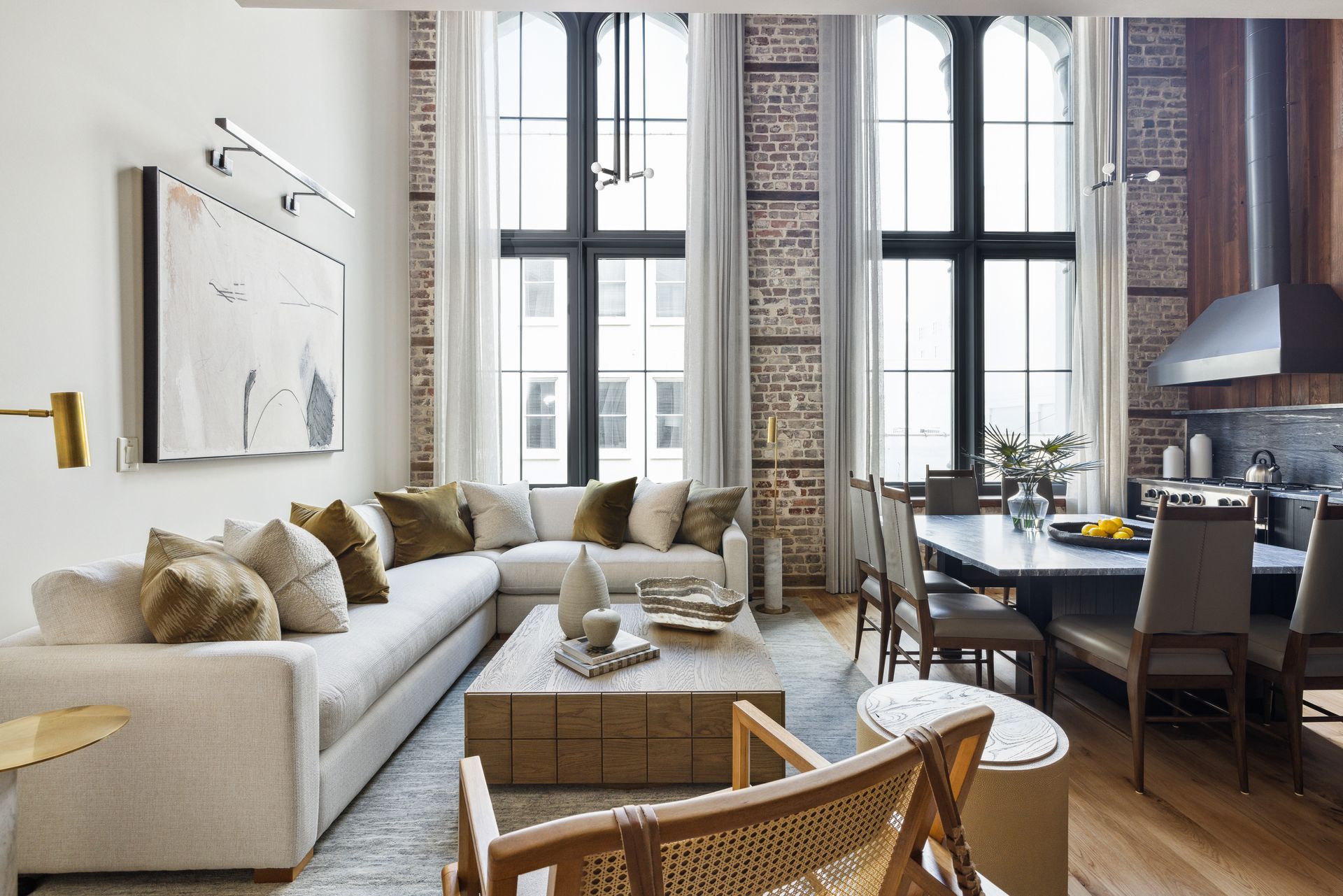 A living room with a couch , coffee table and chairs