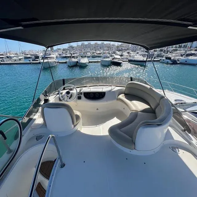 The front of a boat with a canopy over it