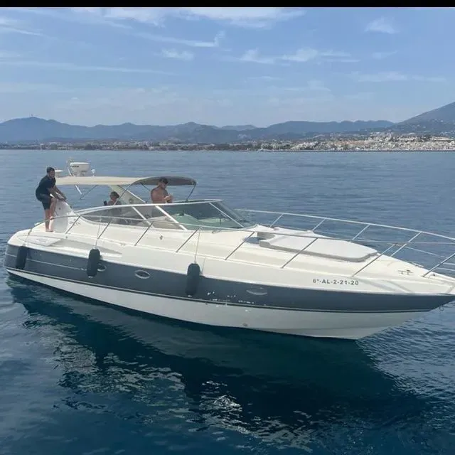 A boat is floating on top of a body of water.