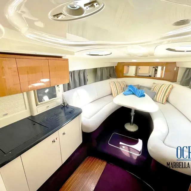 A room with a couch and a table that says ocean marbella