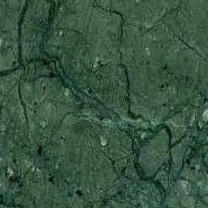 Indian Green - Granitsorte | Grüner Granit mit dunklen Grüntönen, der eine elegante und natürliche Oberfläche darstellt
