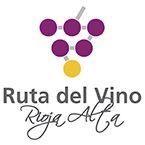 Logotipo con racimo de uvas moradas y amarillas, copa de vino gris y texto “Ruta del Vino Rioja Alavesa”.