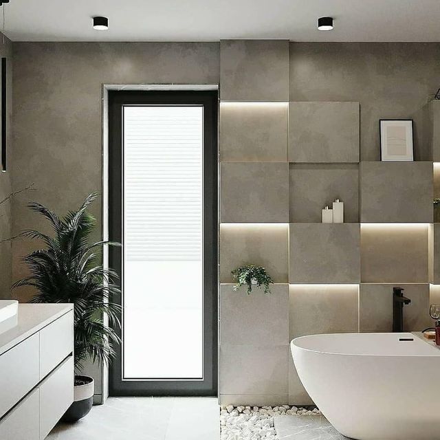 Un baño con bañera, lavabo y ventana.