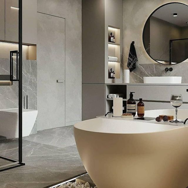 Un baño con bañera, lavabo y espejo.