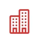 Un icono rojo de dos edificios altos sobre un fondo blanco.