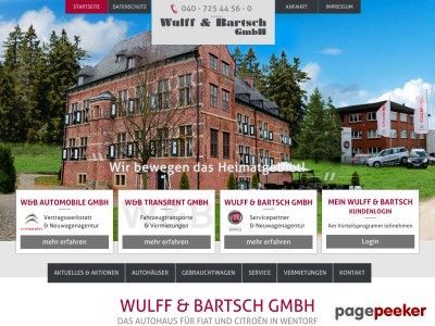 Auf der website der wulff & bartsch gmbh ist ein großes backsteingebäude zu sehen, davor parkende autos.