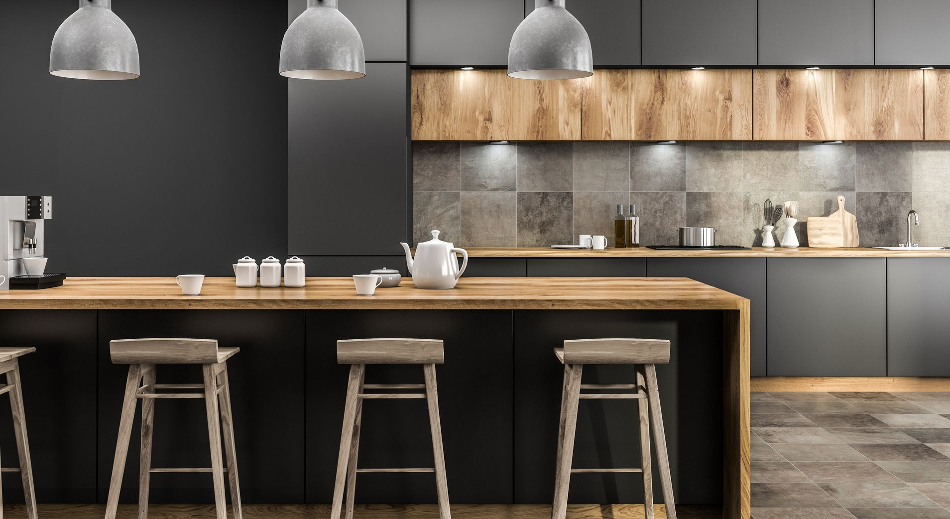 Cuisine moderne avec îlot en bois, tabourets de bar, suspensions lumineuses et meubles gris.