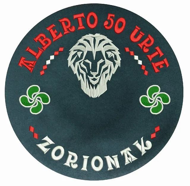 Un logotipo para Alberto 50 Urie Zorionak con un león.