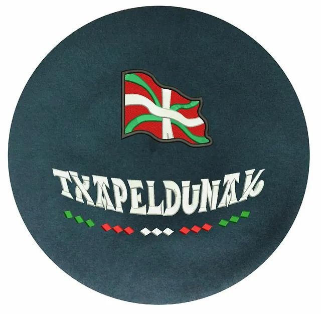 Un círculo azul con la palabra txapeldunak escrita en él