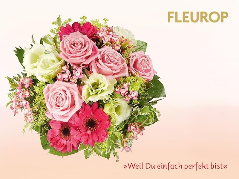 Ein Strauß rosafarbener und weißer Blumen mit der Aufschrift „Fleurop“ auf der Unterseite
