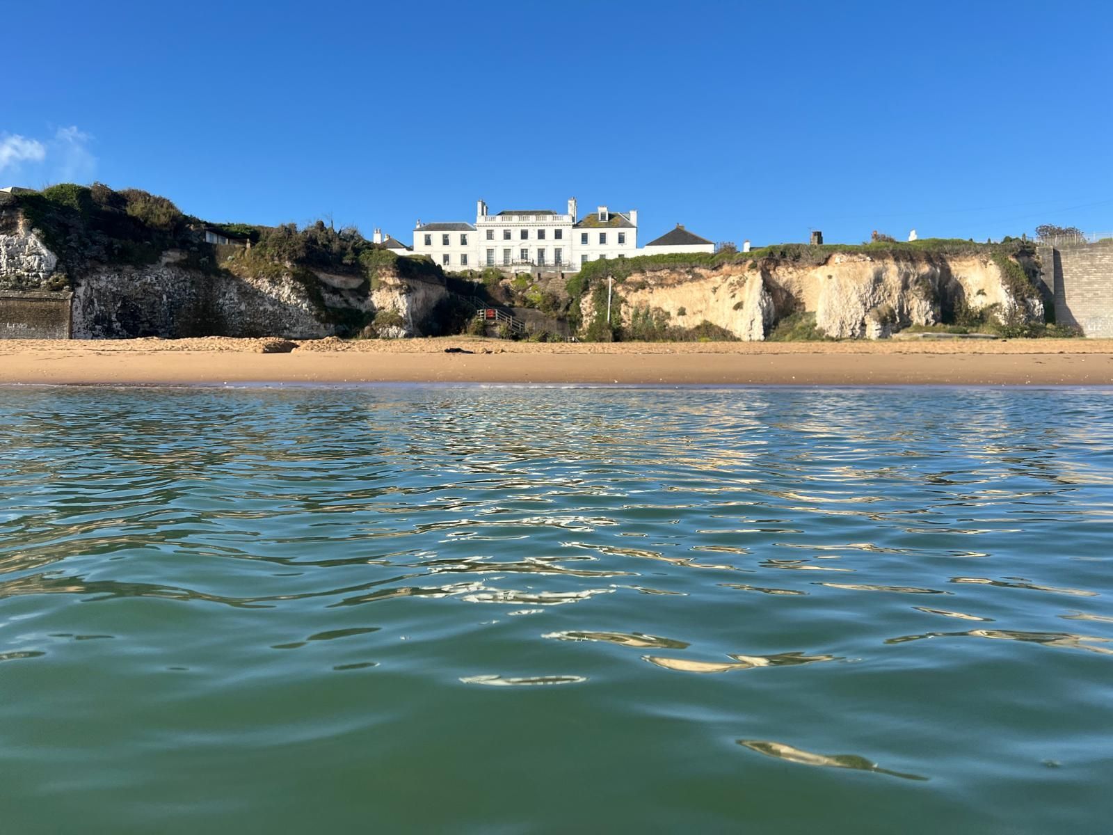 View from the Sea to Kingsgate Bay and Holland House.